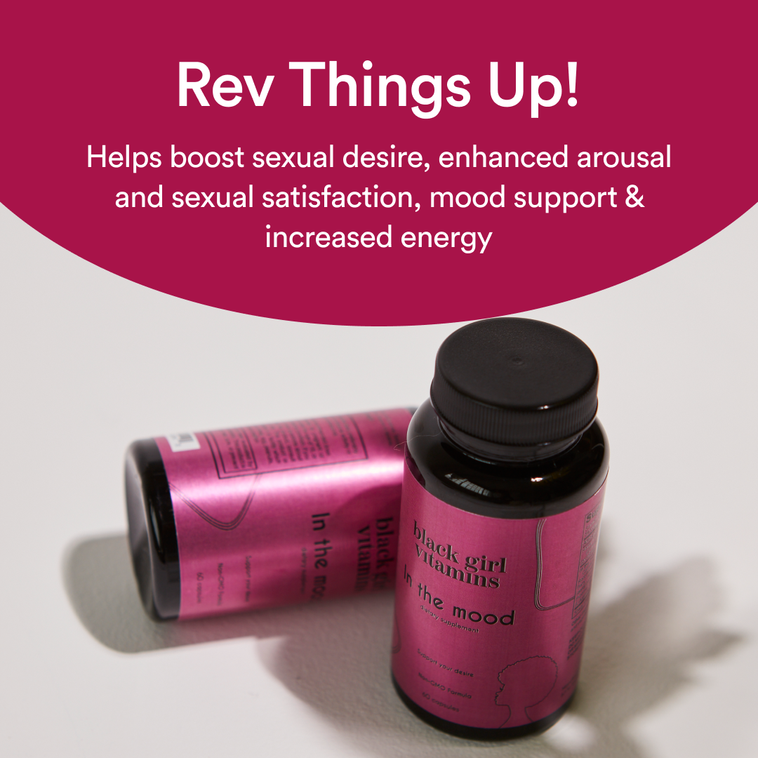 Two pink bottles of Black Girl Vitamins supplement labeled 'In the mood' on a white surface